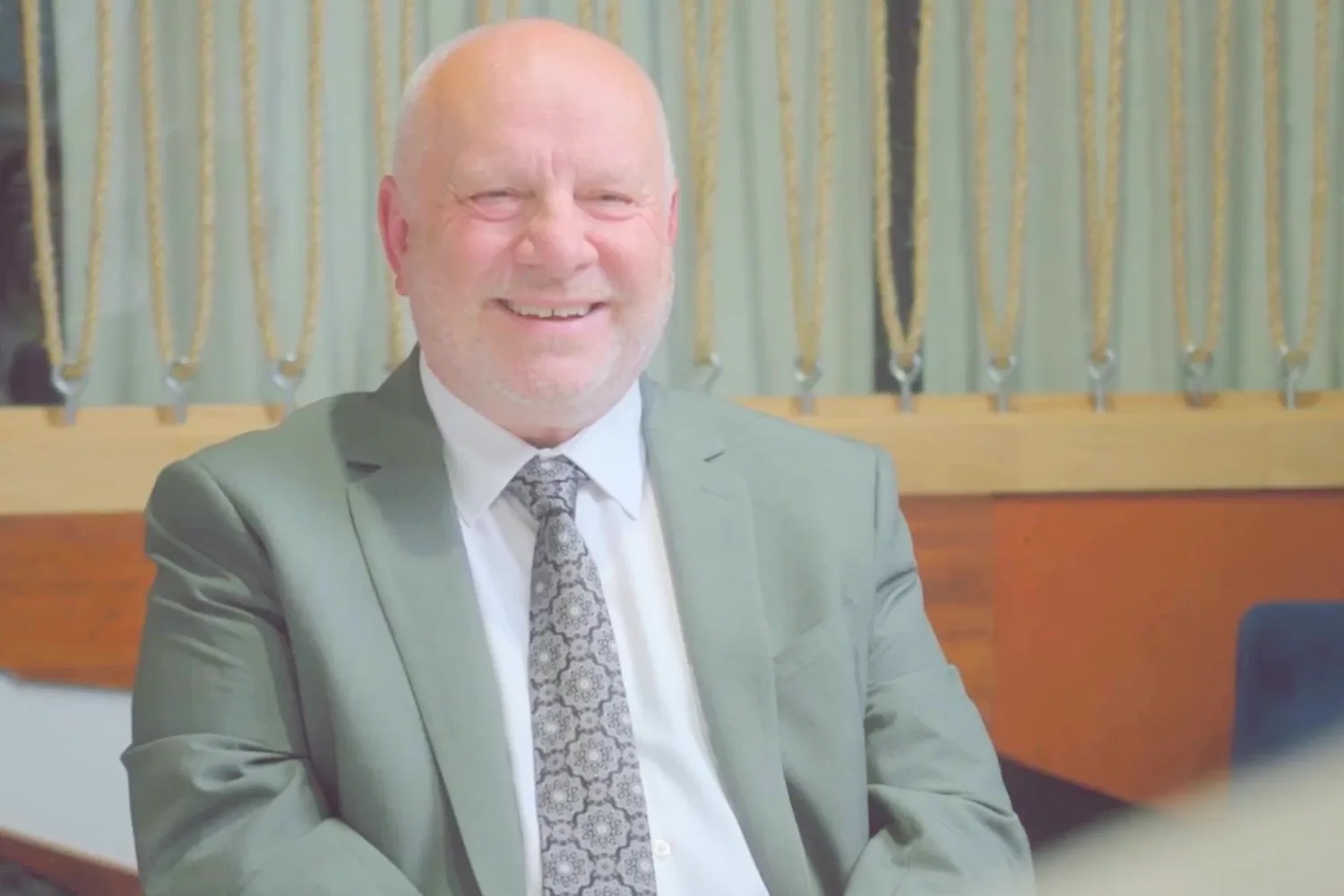 Dr Edwin Elcock, consultant psychiatrist, smiling in the clinic